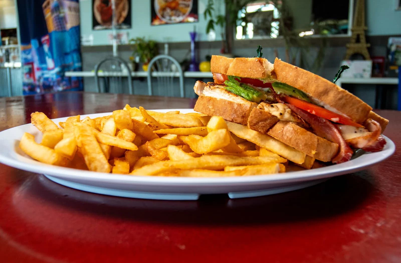 State Line sandwich with chicken, avocado, tomato, bacon and fries